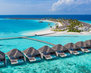 aerial-view-of-maldives-island-luxury-water-villas-resort-and-wooden-pier-beautiful-sky-and-ocean_663265-120