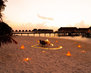 dinner-table-and-chair-on-beach-with-sea-view-background-in-maldives_1339-110422